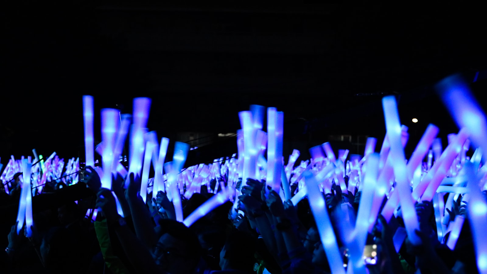 people holding light bars