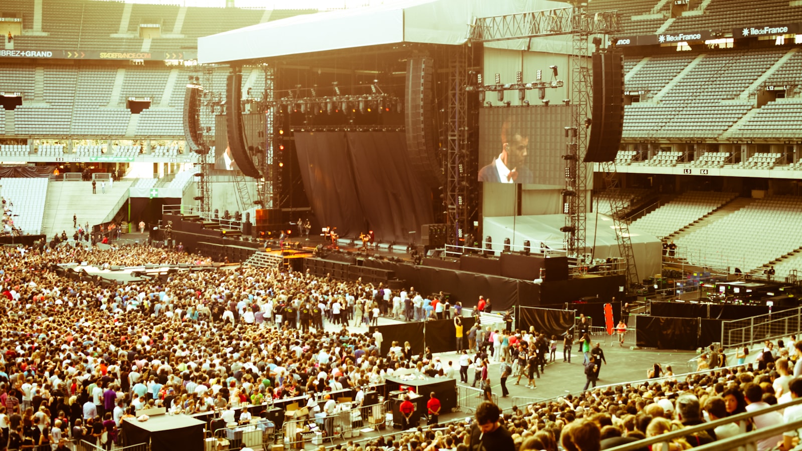 people sitting on chairs inside stadium