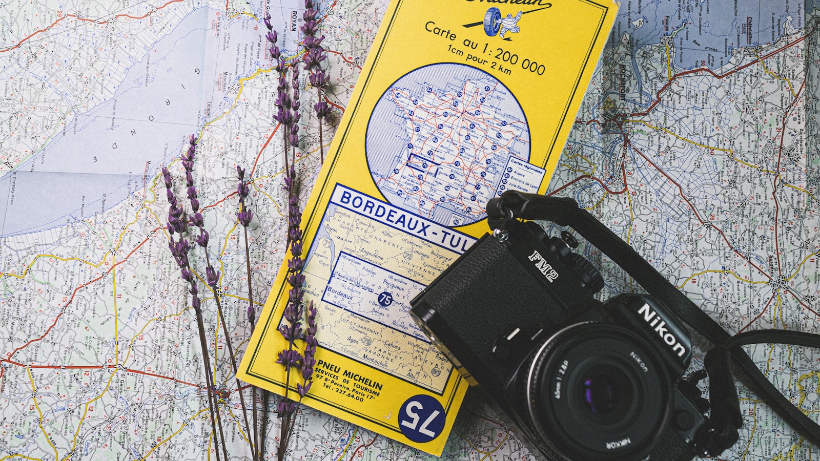 a camera and a map on a table