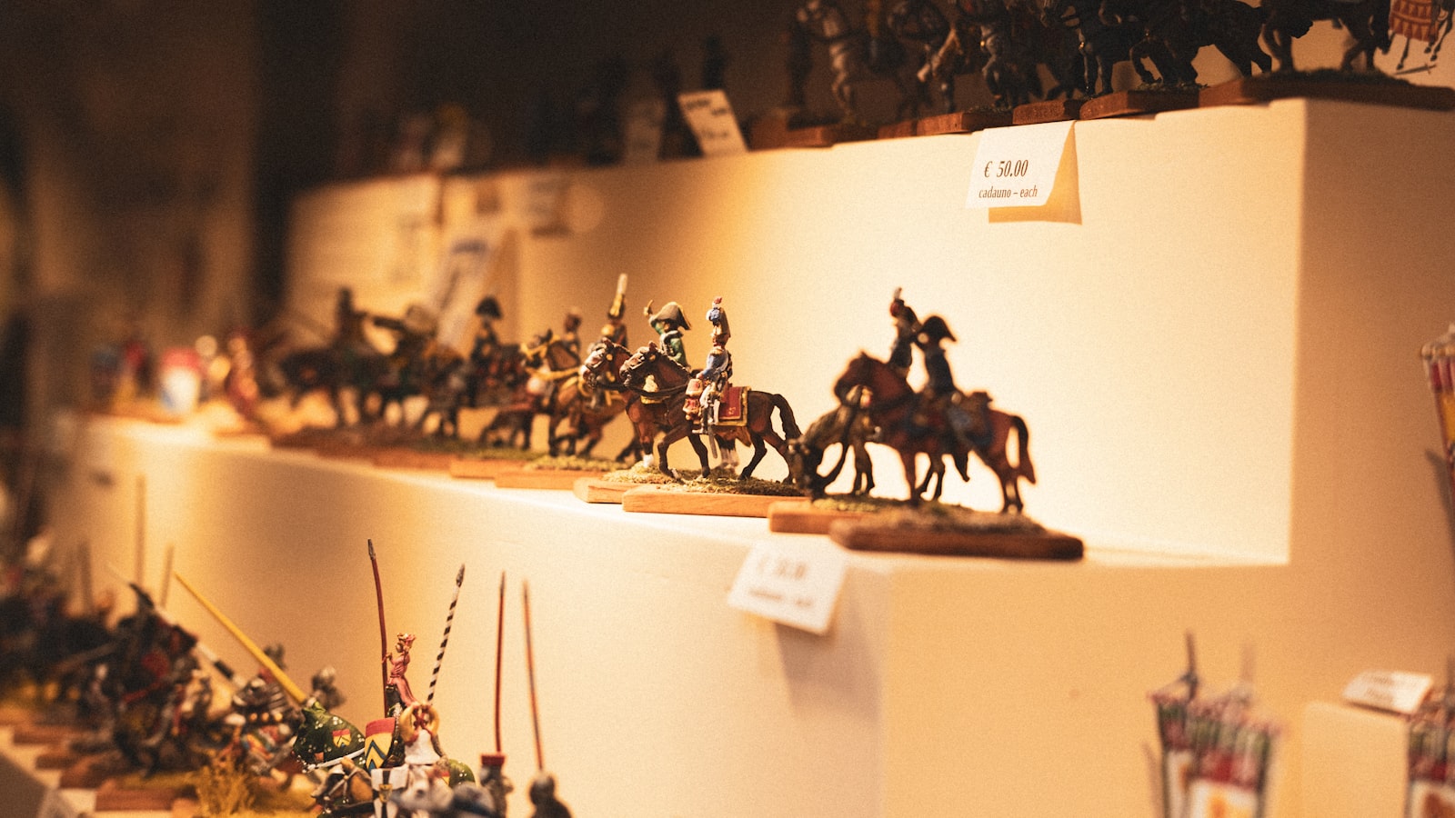 Miniature historical figures displayed on shelves