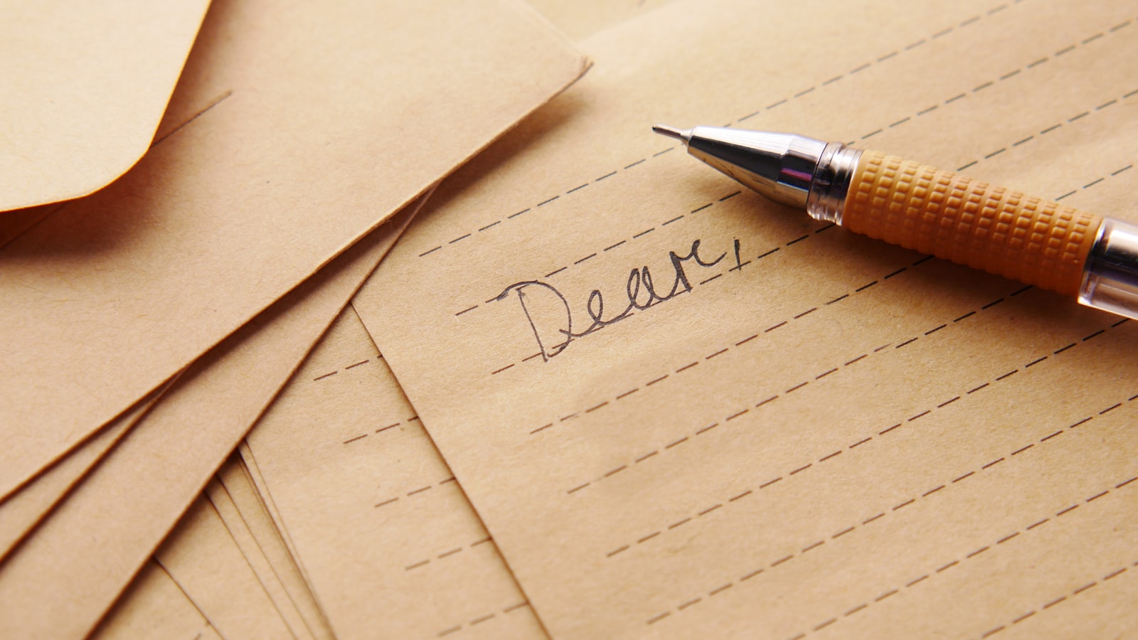 a pen sitting on top of a piece of paper