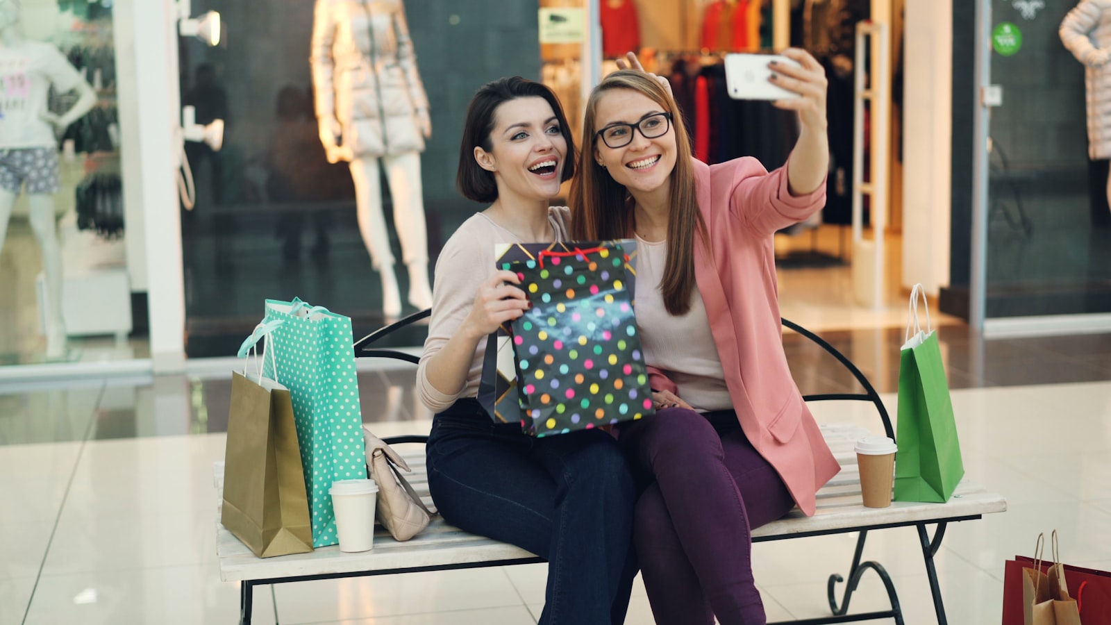 Two women taking a selfie at the mall