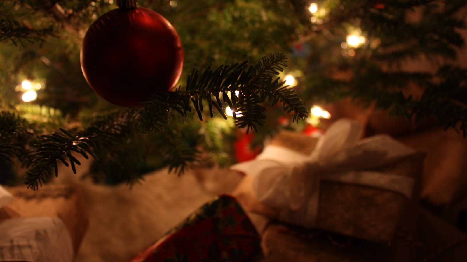 red baubles on green christmas tree